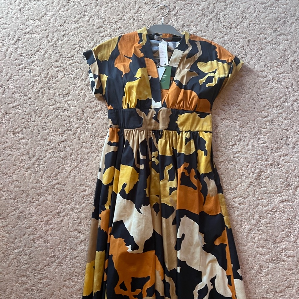 Marella -Black and neutral tone horse print. V neck dress and very flattering.